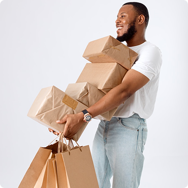 happy shopper carrying shopping bags